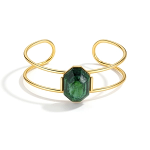 Retro geometric cuff bracelet in gold finish with a large emerald green gemstone center