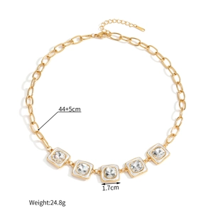 Detailed view of French vintage necklace with square crystals and white enamel finish
