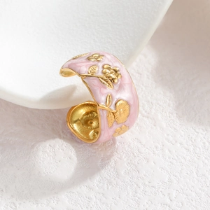 Vintage floral enamel ring with hand-painted gold flowers on a pink background