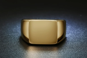 Polished gold stainless steel square signet ring with a smooth mirror finish