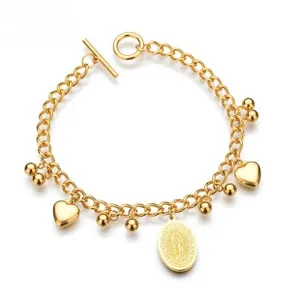 Macro view of gold-plated titanium steel bracelet featuring heart charms and OT clasp detail