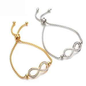 Detailed view of gold and silver infinity bracelets with micro-pave crystals and slider clasp
