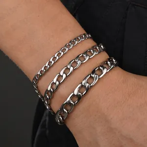 Three widths of minimalist stainless steel Cuban link bracelets worn on wrist