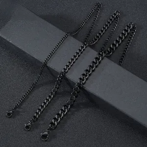 Detailed view of three black stainless steel Cuban curb chains in different widths