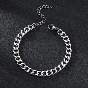 Detailed view of silver Cuban chain bracelet with lobster clasp and adjustable extension