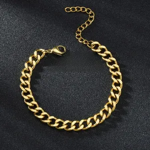 Detailed close-up of a gold Cuban link bracelet featuring a secure lobster clasp and extender