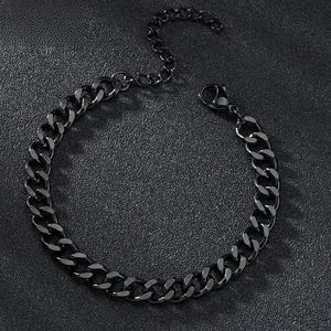 Detailed close-up of a black polished Cuban link bracelet with lobster clasp and extender