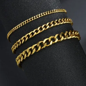 Close-up of three 18k gold-plated stainless steel curb chains in various widths