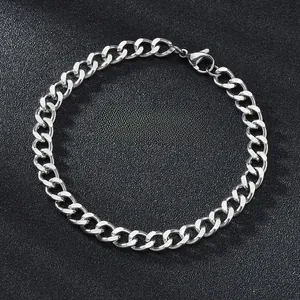 Detailed close-up of a silver Cuban link stainless steel bracelet with a lobster clasp