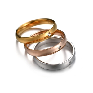 Polished 4mm stainless steel rings set in gold, silver, and rose gold with diamond inlay
