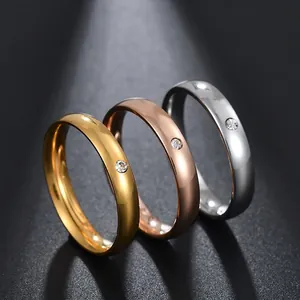 Minimalist 4mm polished dome rings in gold, rose gold and silver with single diamond set