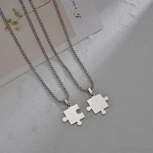 Matching stainless steel puzzle piece necklaces for couples with polished silver finish