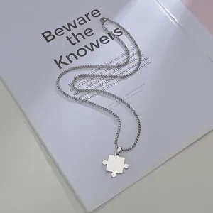 Minimalist silver stainless steel puzzle pendant necklace with a sleek metal snake chain