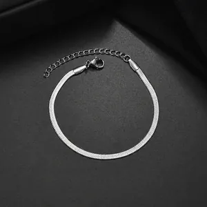 Macro shot of silver stainless steel flat snake chain bracelet with lobster clasp