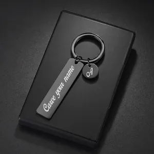 Customized black stainless steel keychain set with rectangular tag and round charm