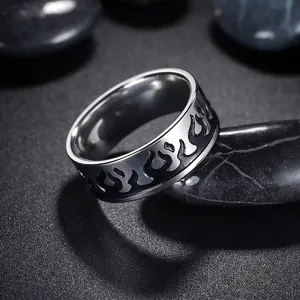 Men's cool flame pattern stainless steel ring with black enamel on a textured background