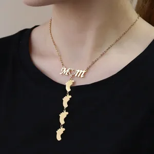Vintage gold stainless steel Mom necklace with heart and four baby feet charms
