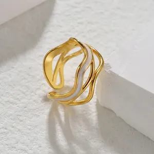 Elegant 18k gold plated stainless steel wave ring with white enamel detail