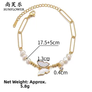 Detail of gold butterfly bracelet with pearls and adjustable stainless steel chain