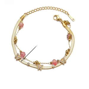 Double-layered golden bracelet with butterfly charms and pink beads measuring 17+5cm in length