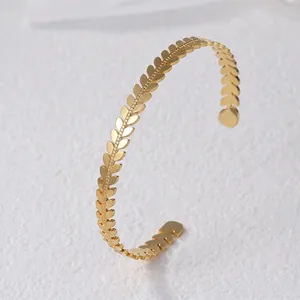 Elegant gold leaf shaped titanium steel open bangle with detailed wheat ear relief