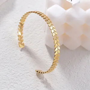 Elegant gold leaf-shaped titanium steel open bangle bracelet for women in retro style
