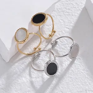Adjustable oval mother of pearl and black inlay rings with twisted cable edges