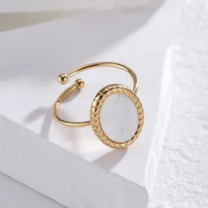 Golden titanium steel open ring featuring an oval mother of pearl shell inlay