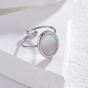 Minimalist silver-tone adjustable ring with oval mother of pearl and rope texture trim
