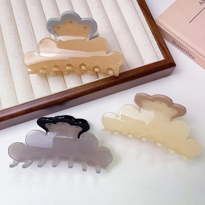 Cloud-shaped acetate hair claw clips in beige, brown and grey colors with glossy finish