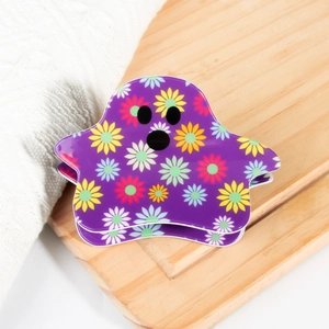 Vue détaillée d'une pince à cheveux fantôme violette avec motif floral coloré et ressort