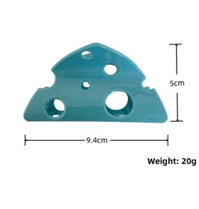 Detail view of bright blue cheese shaped hair claw clip with 9.4cm size specifications