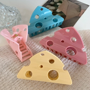 Cheese shaped hair claw clips with hollow holes in pink, blue, and yellow colors