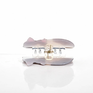 Close-up of cat-ear hair claw clip with purple and pink marble pattern acetate