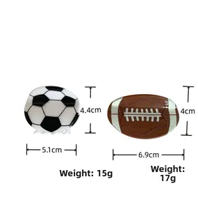 Detail view of soccer and rugby shaped hair clips with precise dimensions and weight