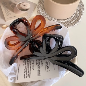 Large tortoiseshell and black resin hair claws in butterfly shape for thick hair