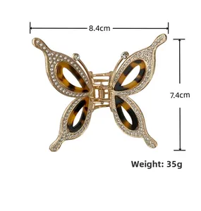 Detailed size specifications for rhinestone butterfly hair claw with 35g weight measurement