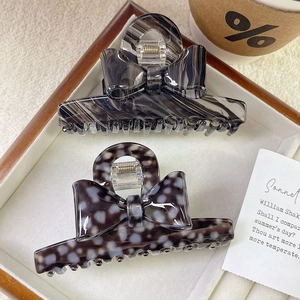 Elegante set di fermagli per capelli a fiocco in acetato con motivi marmorei e leopardati