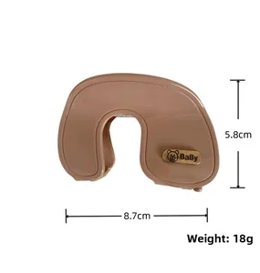 Detail of a large brown matte hair claw clip with baby bear metallic logo, 8.7cm width