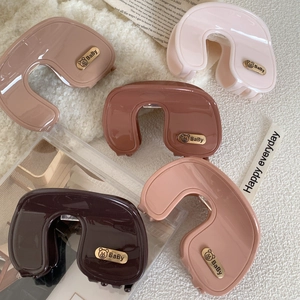 Maillard acetate large hair claw clips set in five earthy colors with golden baby bear detail