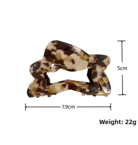 Star-shaped acetate hair claw with marble pattern, size 7.9cm x 5cm, weight 22g