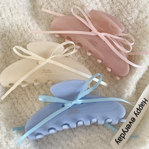 Pastel acetate claw clips with ribbon bows in pink, beige and blue colors