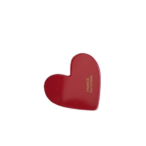 Sweet red heart-shaped acrylic hair clip with gold France Handmade logo on white background