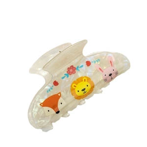 Cute animal print hair claw clip with fox and rabbit motifs on pearly white background