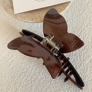 Elegant tortoiseshell acetate butterfly hair claw clip with a glossy polished finish