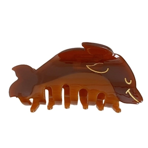 Elegant amber dolphin hair claw clip made of acetate with glossy finish and gold details