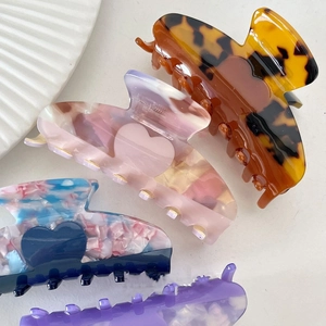Elegant acetate hair claw clips with heart patterns and tortoise shell textures set