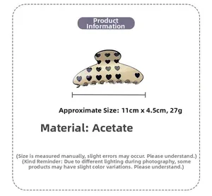 Detailed view of 11cm acetate claw clip with heart pattern showing size and weight