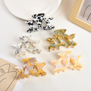Five-piece set of acetate claw clips with marble textures and a minimalist cross-tooth design
