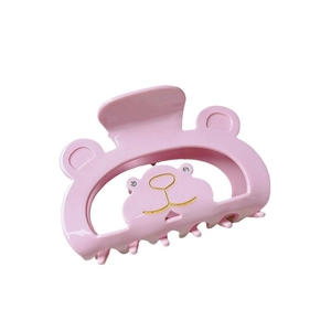Pince à cheveux ours rose en acétate avec détails en strass sur fond blanc minimaliste